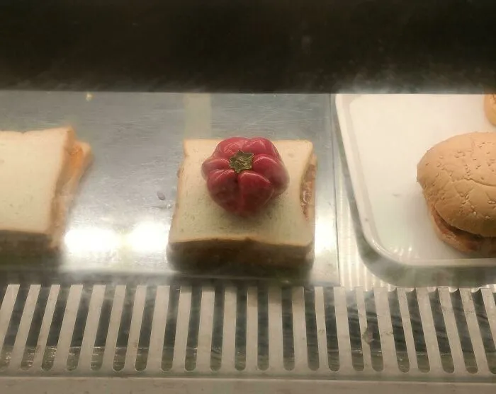 Whole bell pepper placed on a slice of bread as a questionable food combo