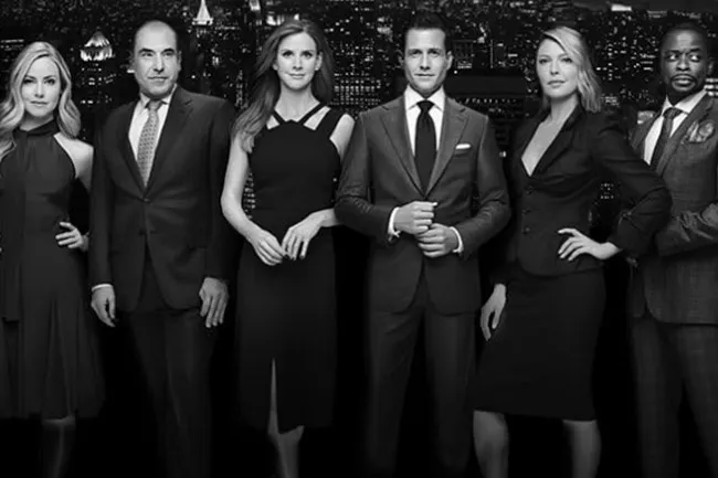 Black and white cast photo of Suits against a city skyline. A great TV show to choose.