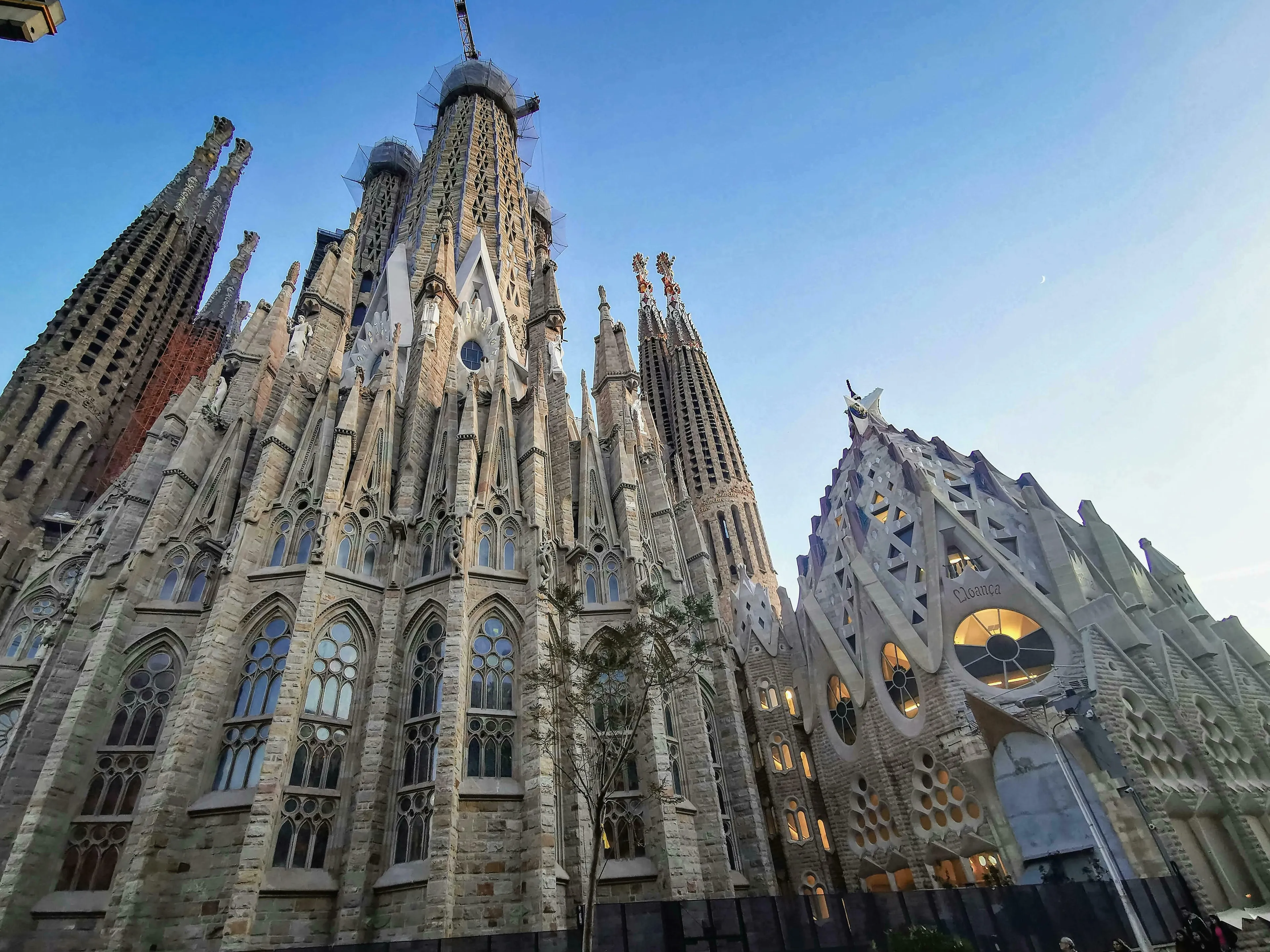 Sagrada Familia, a grand basilica in Barcelona, under a clear sky. Perfect for a general knowledge quiz question.