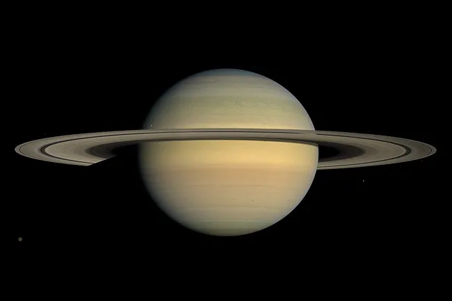 A vibrant image of the planet Saturn and its prominent rings against the dark expanse of space.