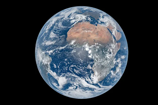 A full view of the planet Earth, showing Africa and clouds over the Atlantic, ideal for choosing a planet.