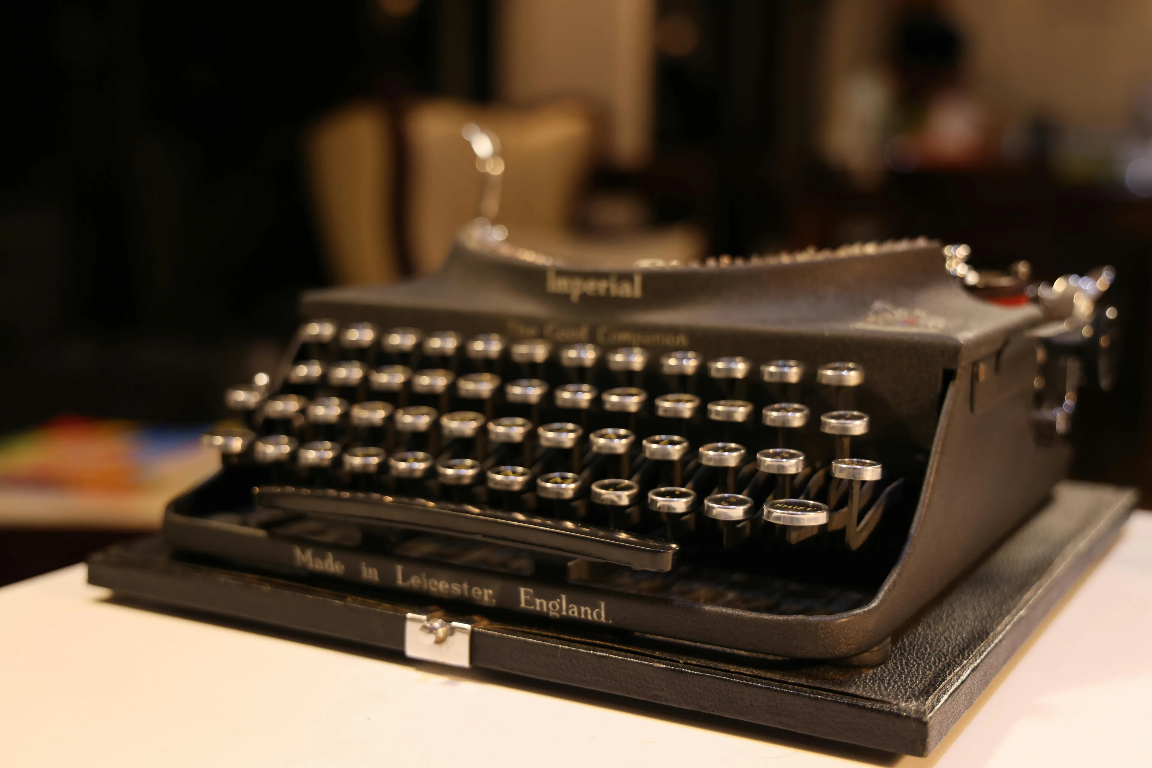 Close-up of a vintage black Imperial Typewriter, Made in Leicester, England, a classic gadget from a box of old gadgets.
