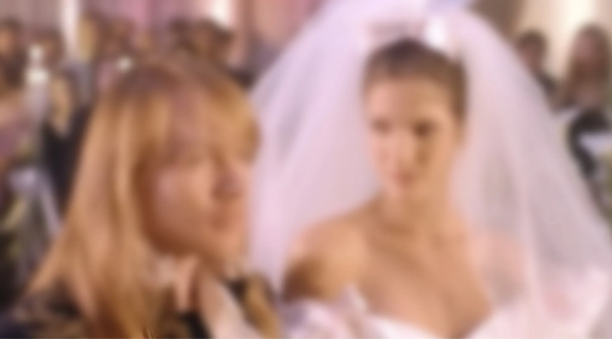 A blurry music video image of a long-haired man and a woman in a wedding dress. Blurry music videos quiz.