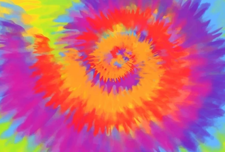 A vibrant tie-dye pattern in a spiral design, featuring bright shades of orange, red, purple, blue, and green.
