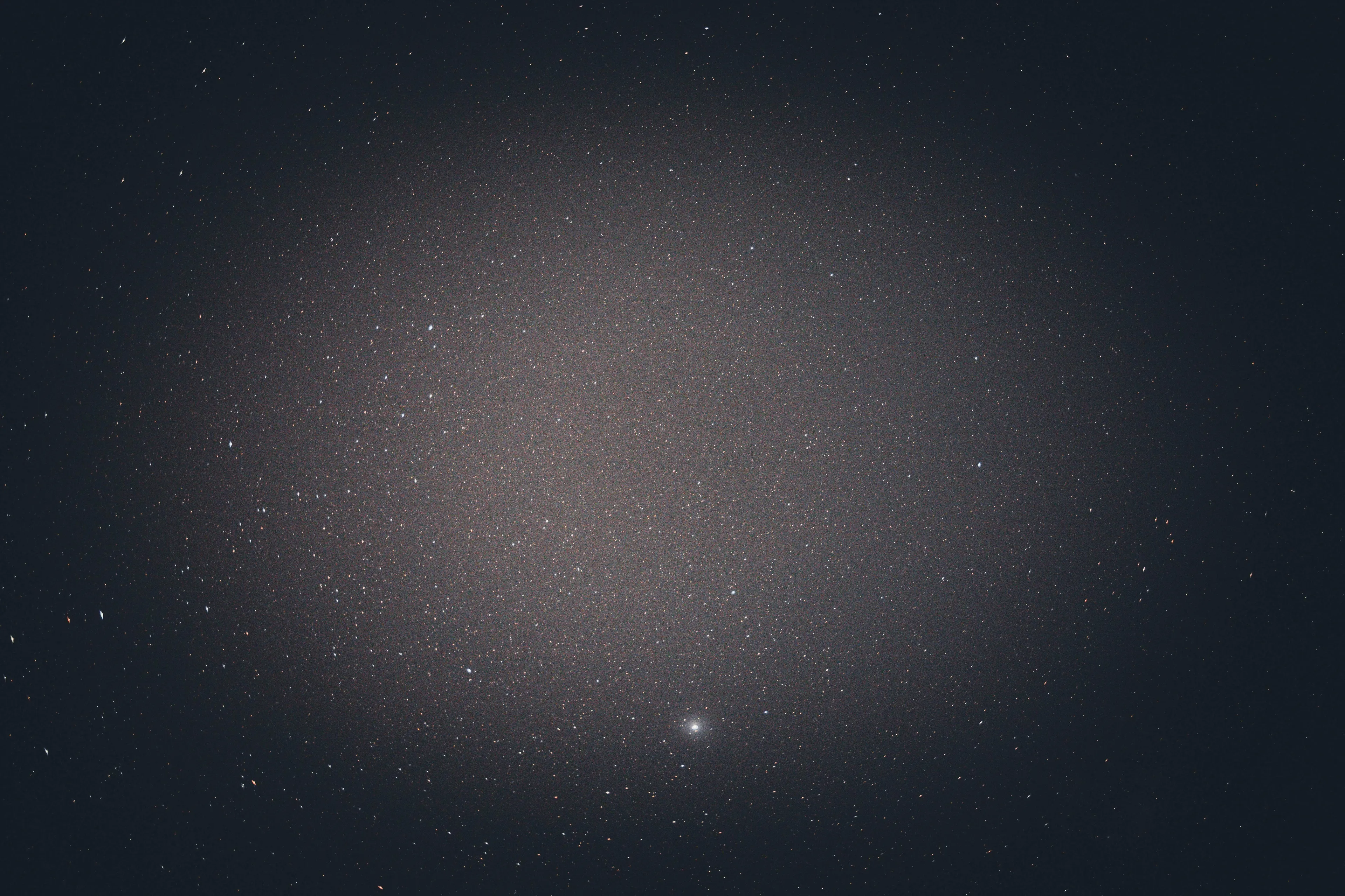A dark night sky filled with countless stars, illustrating why distant stars appear to twinkle, for a science general knowledge quiz.