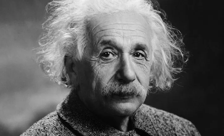 Black and white close-up of Albert Einstein, with wild white hair and a mustache. Science General Knowledge Quiz.