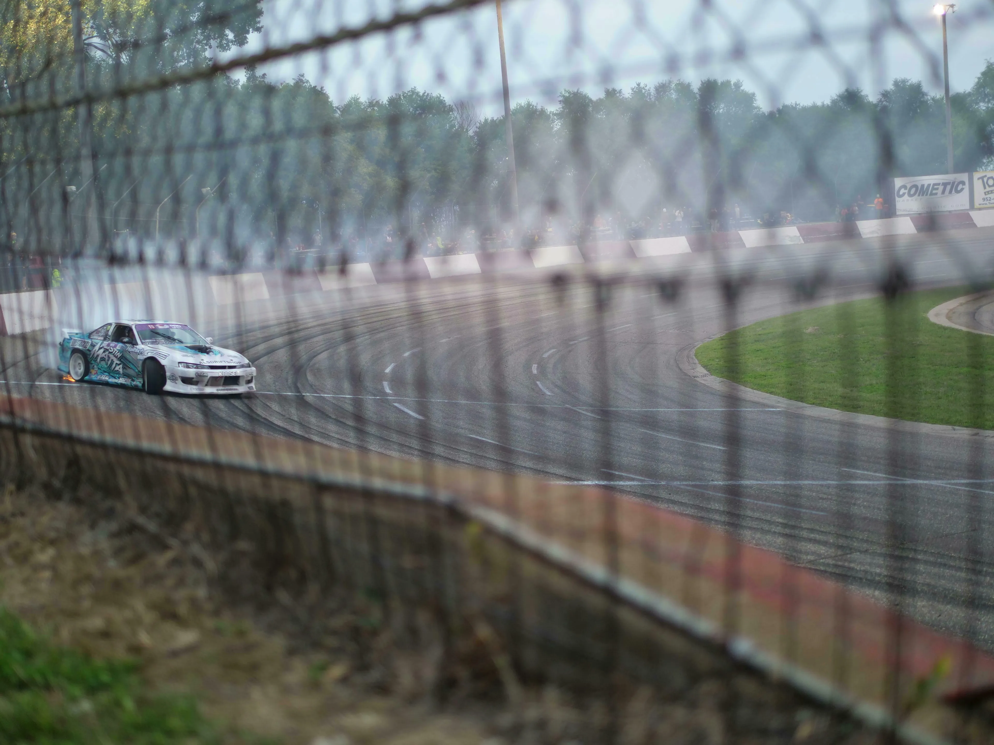 A race car drifting on a track, creating smoke behind it. The Great British Vocabulary Quiz: Part 2.