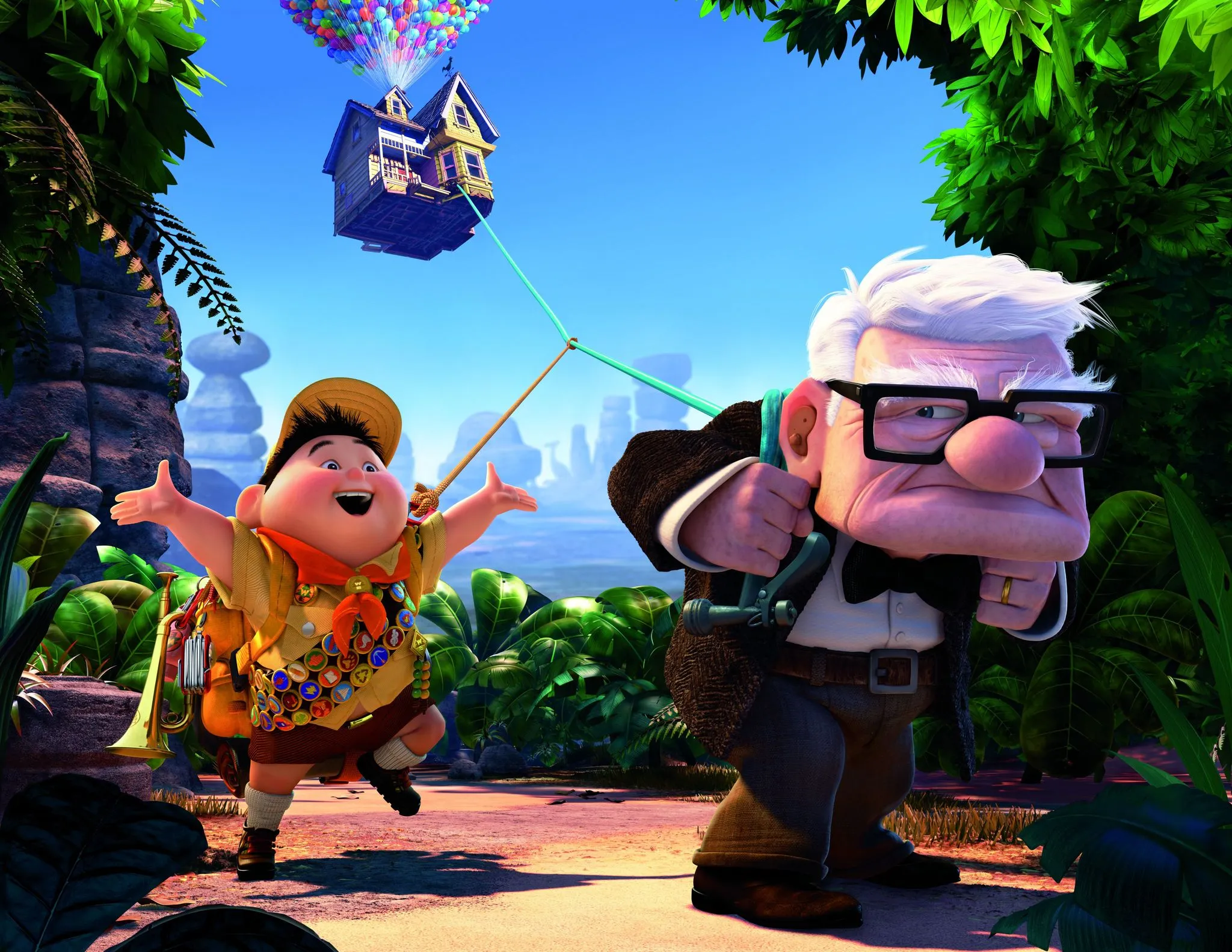Carl and Russell from the movie Up, with a balloon-borne house in the background. Watch tonight!