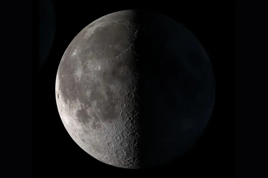 The Last Quarter moon phase, half-illuminated and showing craters, set against the blackness of space.
