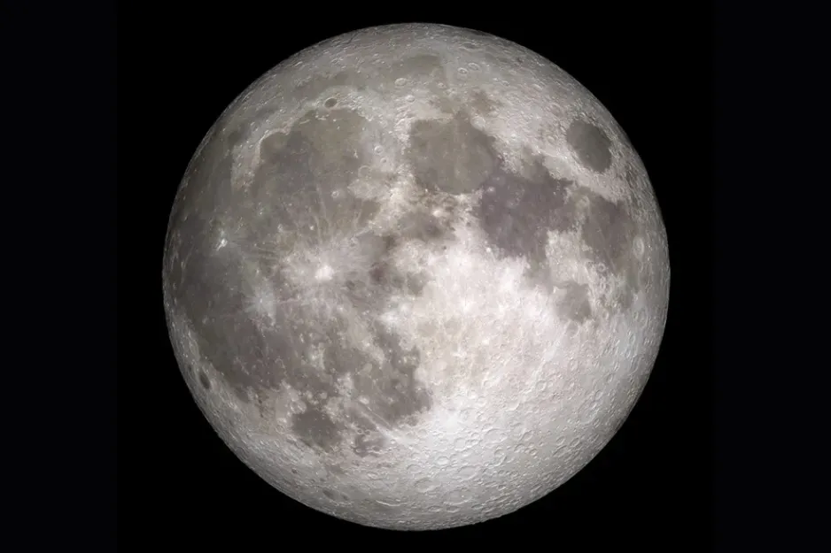 A detailed shot of the Full Moon, showing its craters and maria against a dark sky, highlighting its majestic presence.