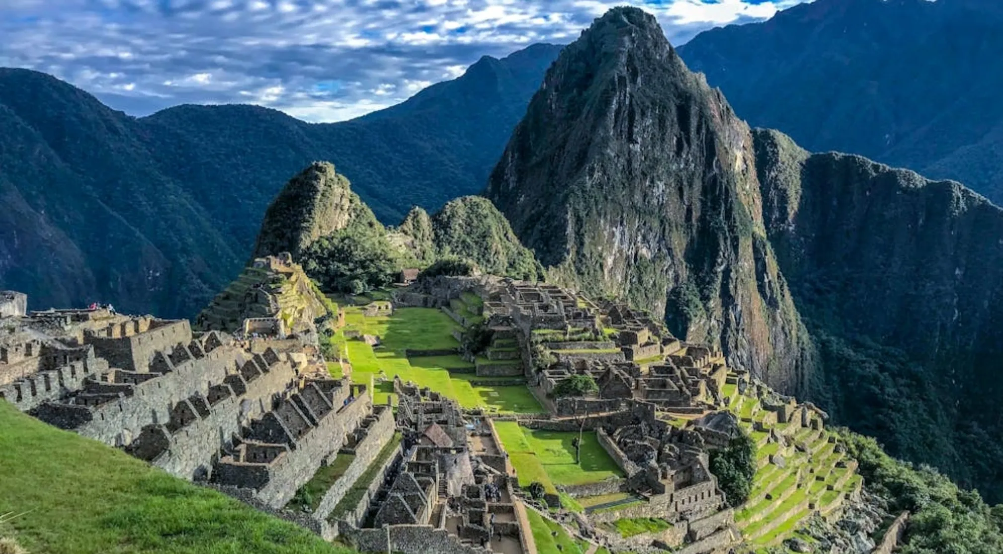 Machu Picchu's ancient Inca citadel nestled among lush mountains, a historical site in South America.