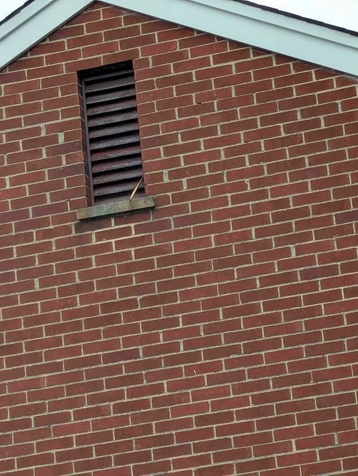 In The Apartment Building Next To Mine There Is An Attic Window/Vent. This Window/Vent Has A Hose Coming Out Of It That Periodically Spits A Stream Of Water. What The Heck Is This?!