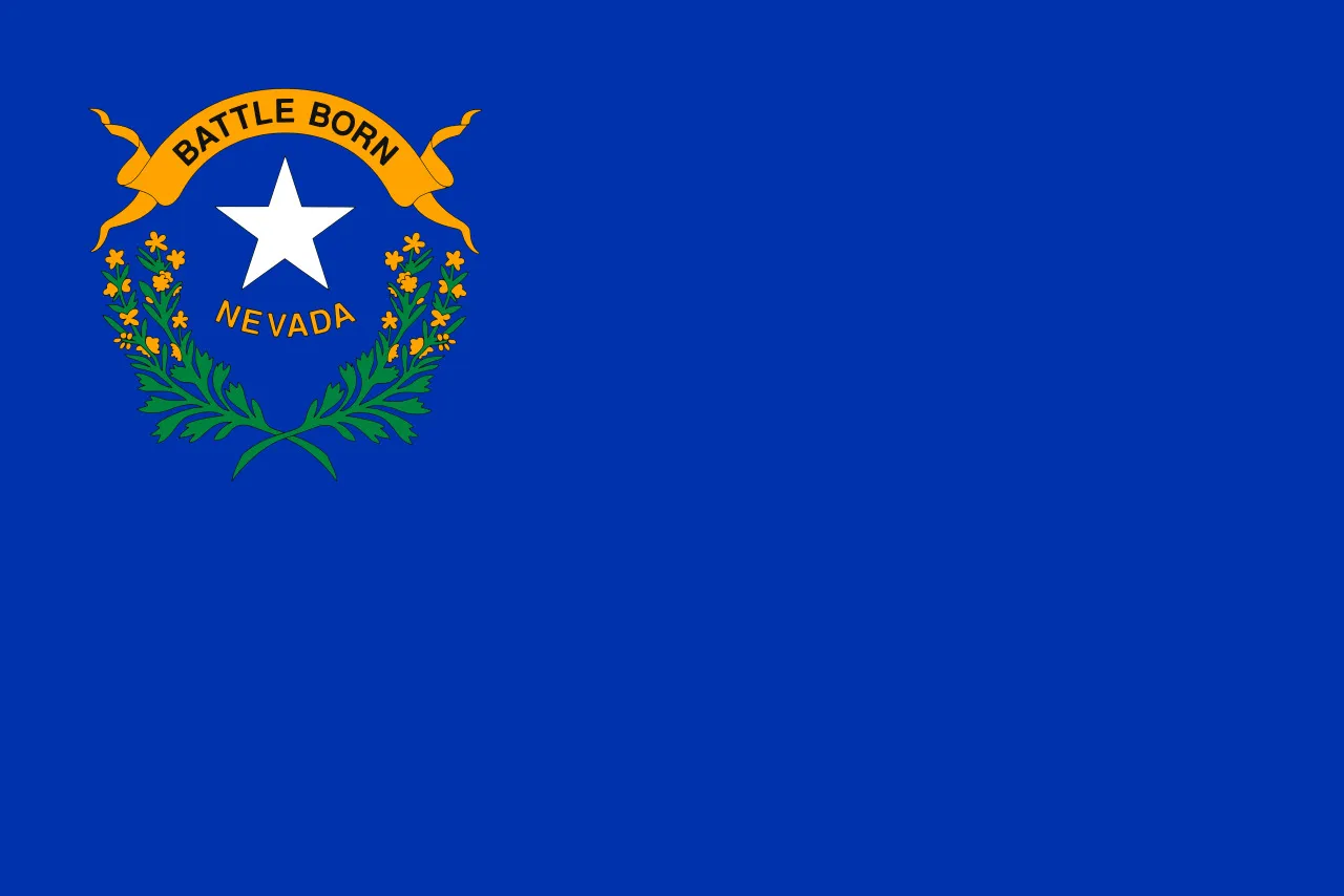 The Nevada state flag, predominantly blue, featuring the Battle Born scroll, a white star, and sprigs of sagebrush, for a US State Capitals quiz.