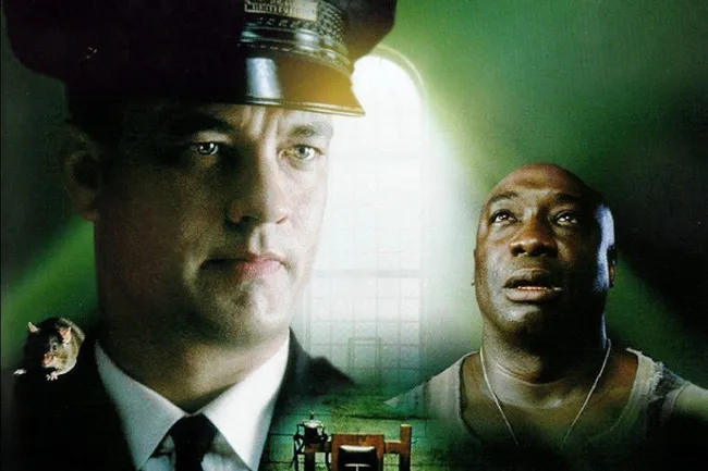 Movie poster for The Green Mile, showing Tom Hanks as Paul Edgecomb and Michael Clarke Duncan as John Coffey.