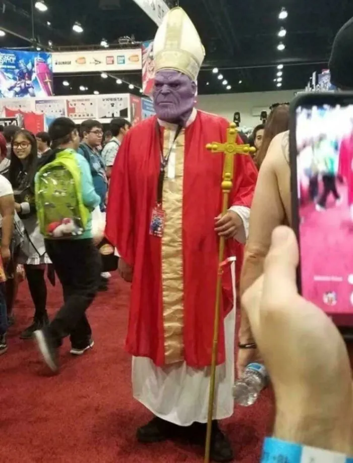 Cosplayer dressed as Thanos in pope robes at convention