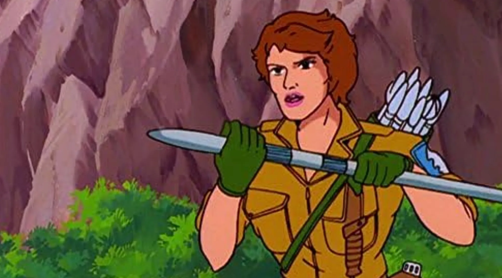 A cartoon character with brown hair, in a tan uniform and green gloves, holding a weapon. Saturday Morning Cartoons Trivia.