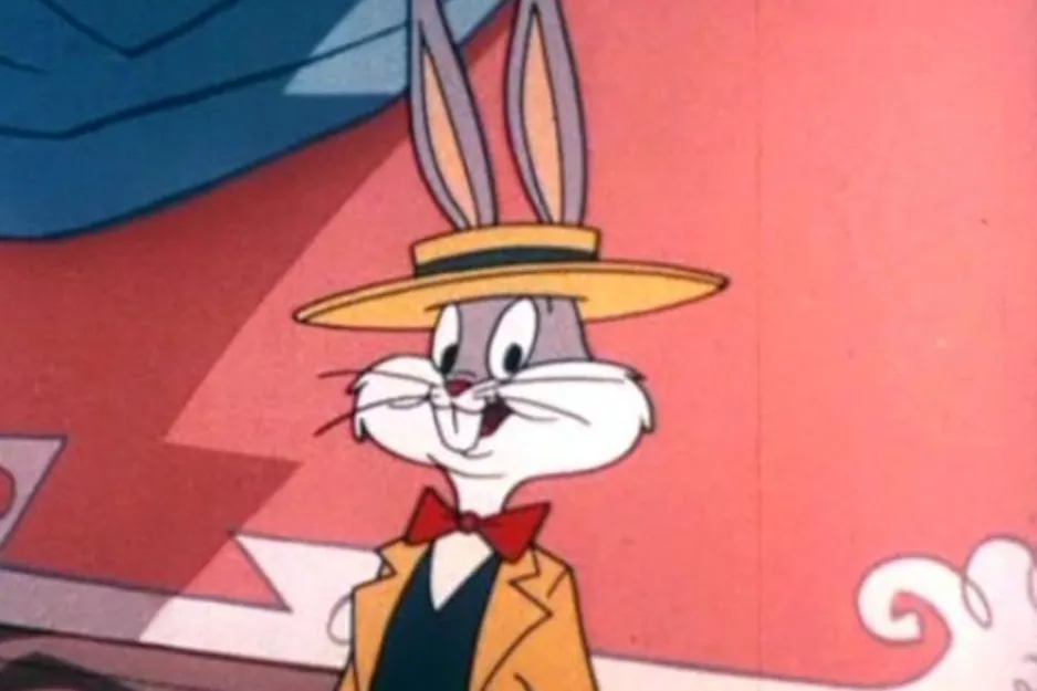 Bugs Bunny, dressed in a yellow suit and straw hat with a red bow tie, smiling with his signature buck teeth. This hunter's nemesis.