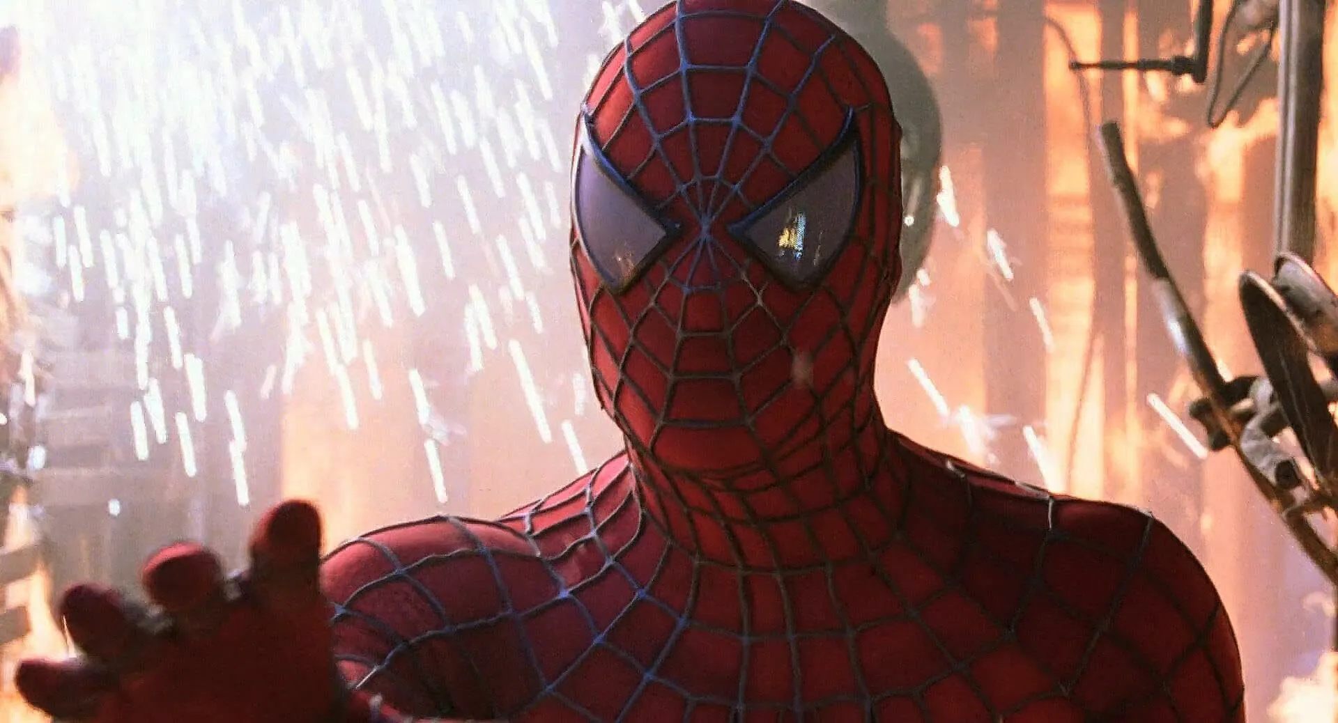 Spider-Man in his iconic red and blue suit, surrounded by sparks, hand outstretched. Pop culture fact.