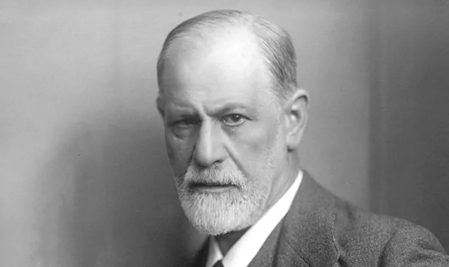 Black and white portrait of Sigmund Freud, a thinker known for exploring unconscious drives and repressed memories.