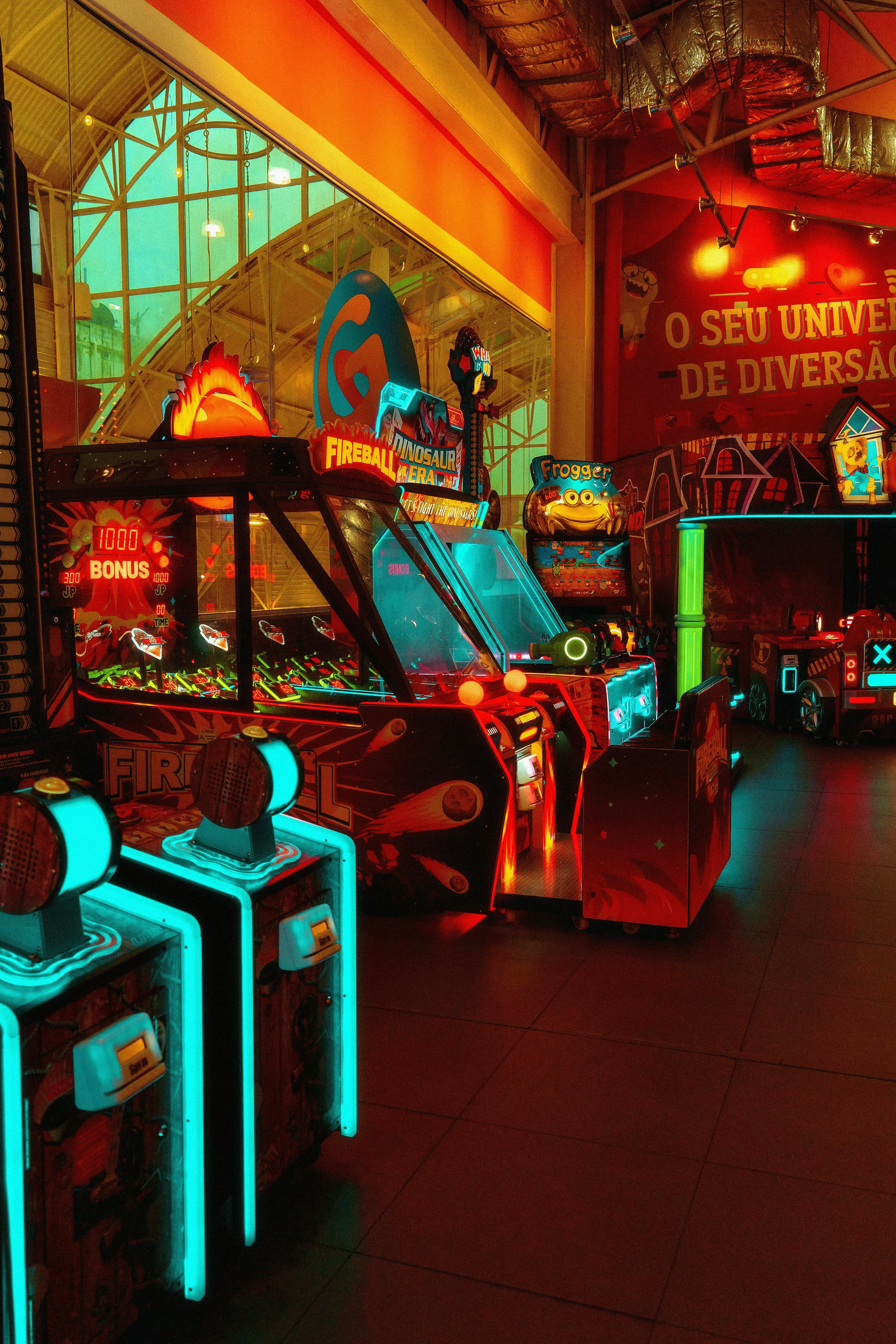 An arcade with various colorful games, including Fireball and Frogger. General Knowledge A-Z, Pac-Man.