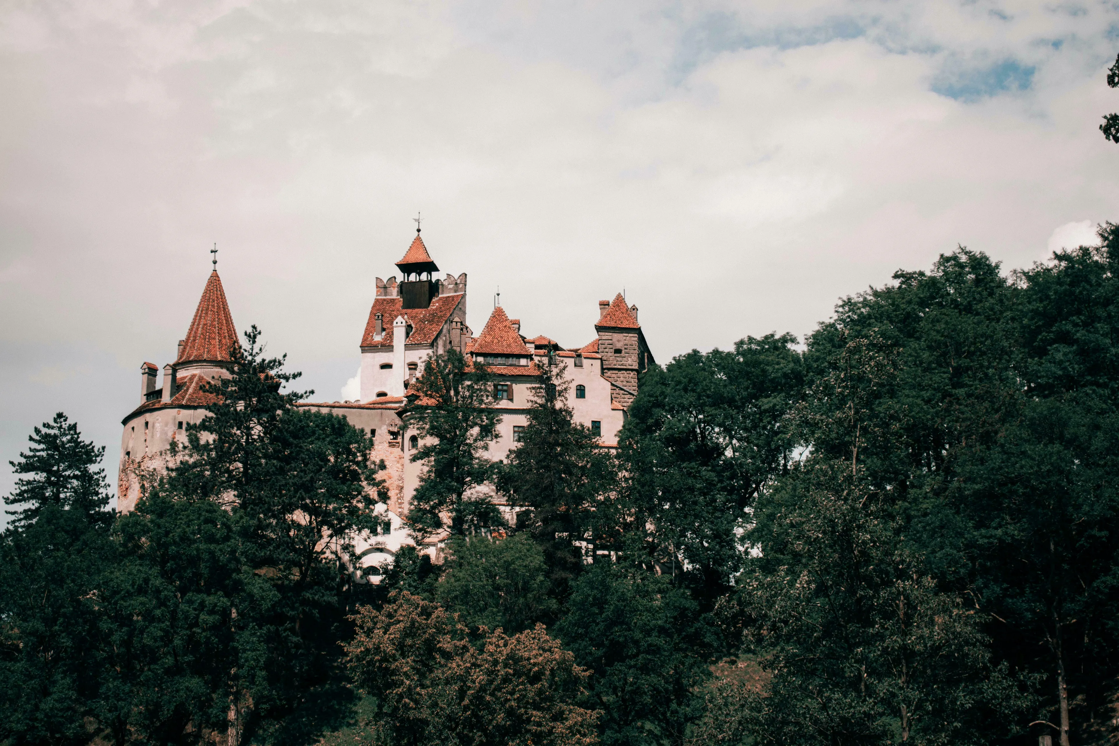 Bran Castle in Transylvania, a mystical land, rises from Gothic fairy tales, known as Dracula's home.