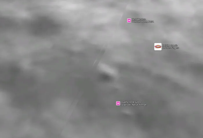Blurry satellite image showing NASA area with Google Maps shenanigans icons