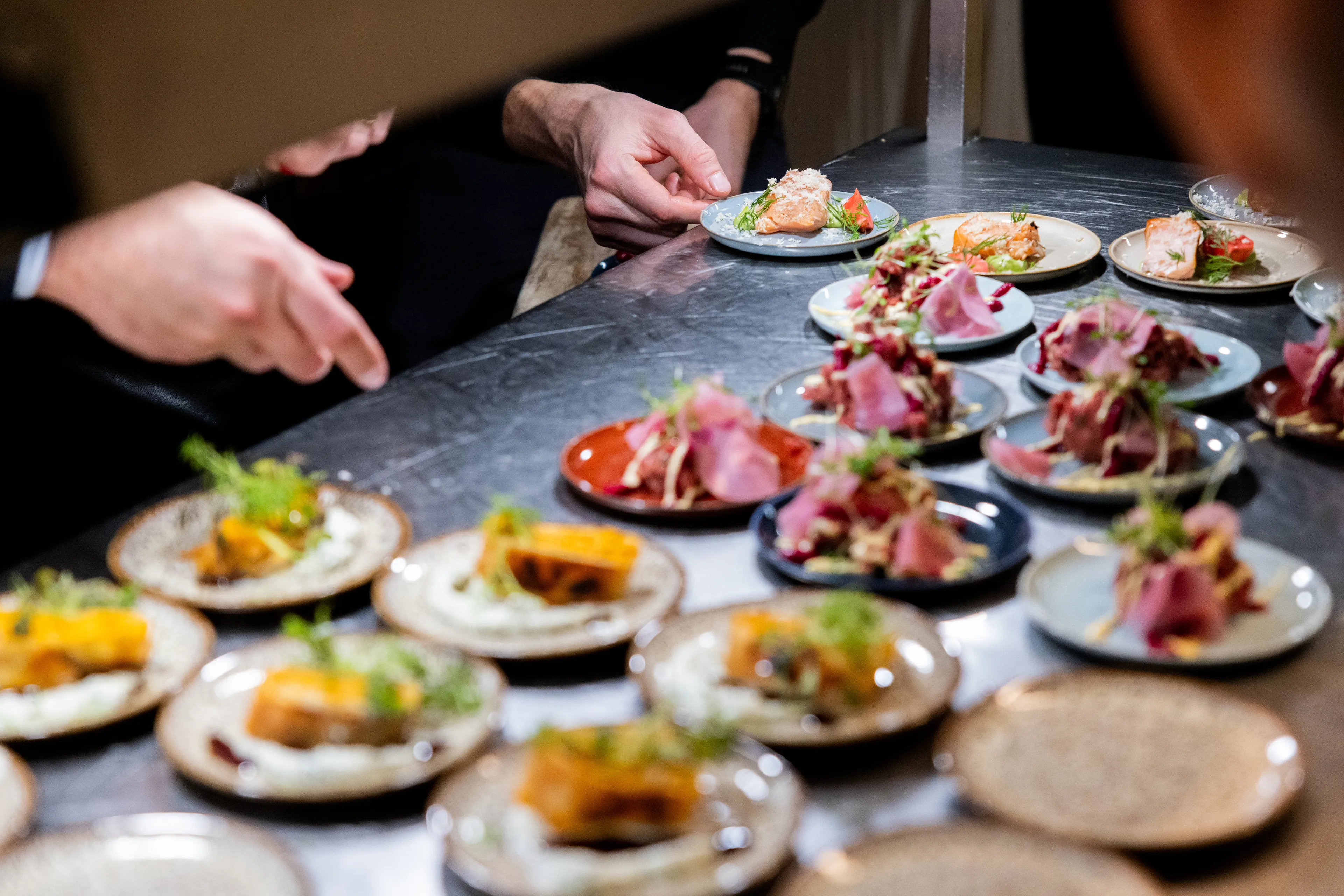 A chef plates intricate appetizers, showcasing a new type of food. How do you react to change and new culinary experiences?
