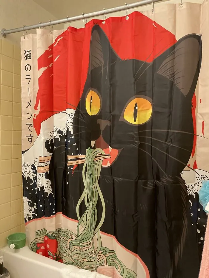 This Shower Curtain Has An Hilarious Design Of A Demented Cat Rising Out Of The Sea And Slurping Ramen