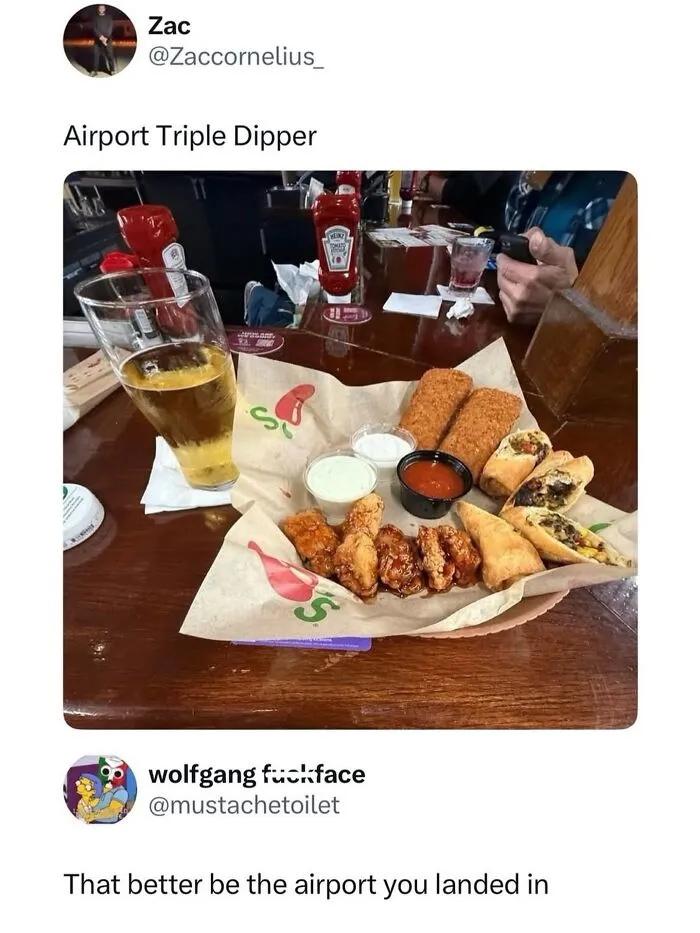 Airport food platter with sauces and beer glass at airport restaurant
