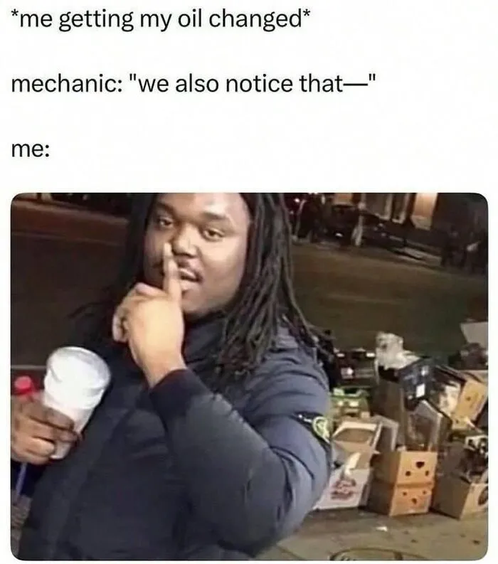Man making silence gesture humor about avoiding mechanic's advice during oil change