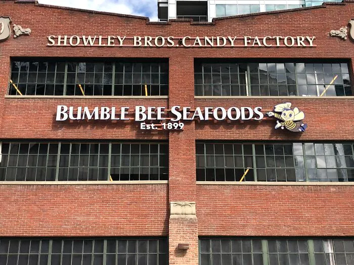 Brick building with Showley Bros. Candy Factory and Bumble Bee Seafoods signs. Disturbing death stories come to mind.