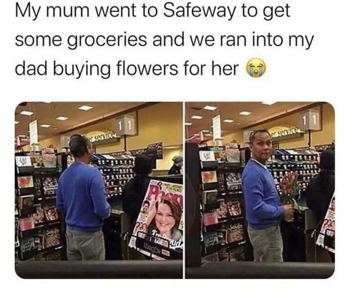 A man in a blue sweater holding flowers at a Safeway checkout, a heartwarming moment that might make your day.