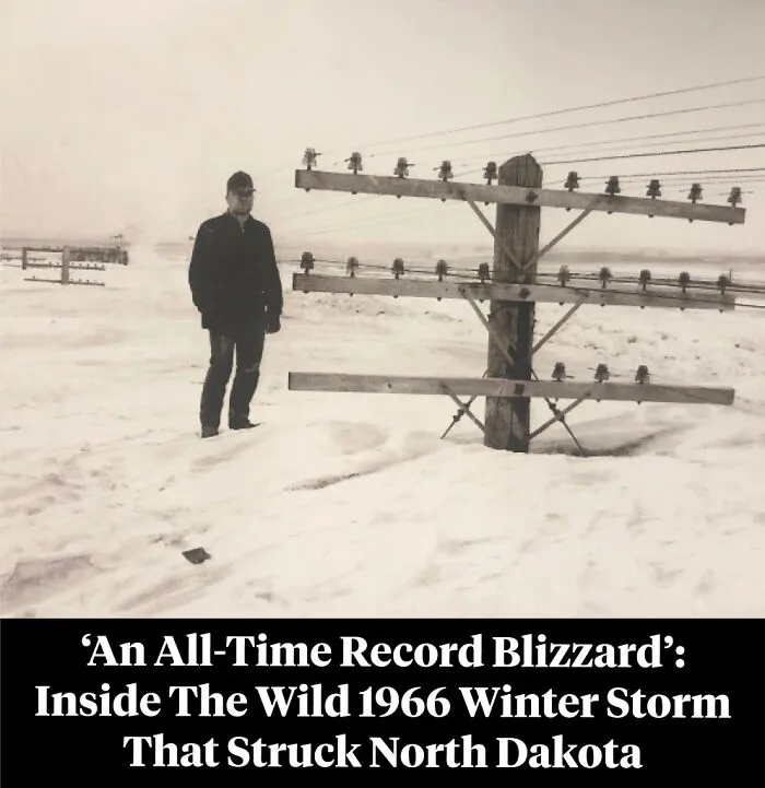 Man standing in deep snow near telephone poles during 1966 North Dakota blizzard