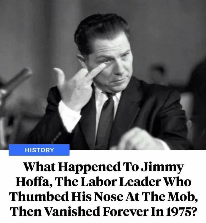 Black and white photo of Jimmy Hoffa making a thumbing nose gesture