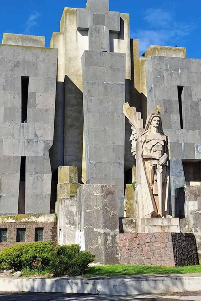 Monument with soldier statue and cross in dystopian historical architecture