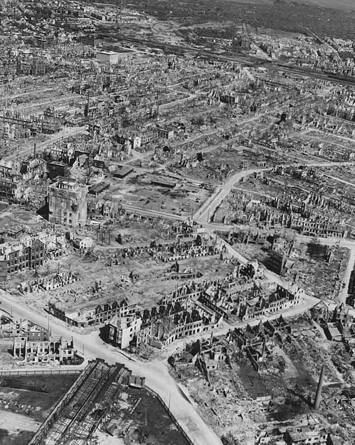 Aerial view of a war-torn city showing extensive dystopian destruction and ruins