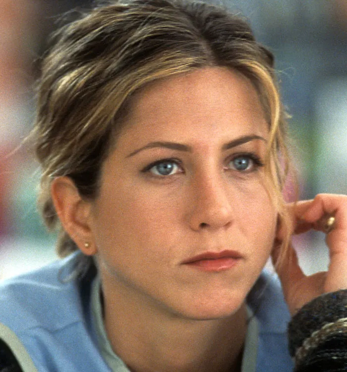 Actress in contemplative pose with subtle buccal fat removal features