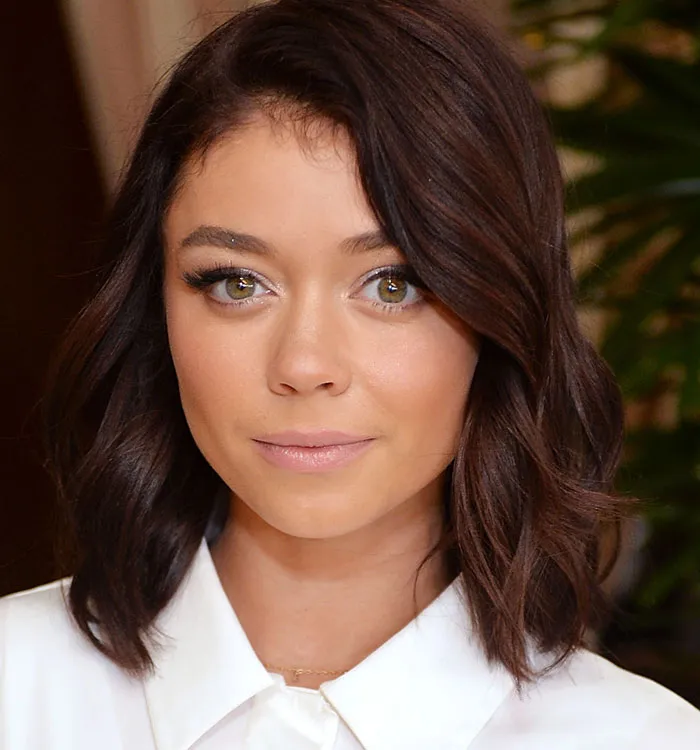 Brunette celebrity with smooth skin after buccal fat removal procedure