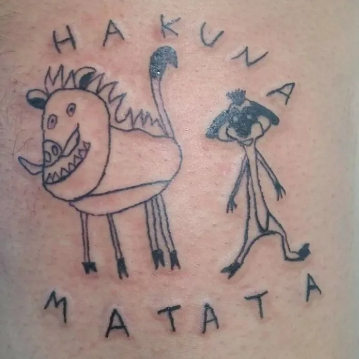 Hilarious tattoo fail depicting poorly drawn Pumbaa and Timon from The Lion King with Hakuna Matata.