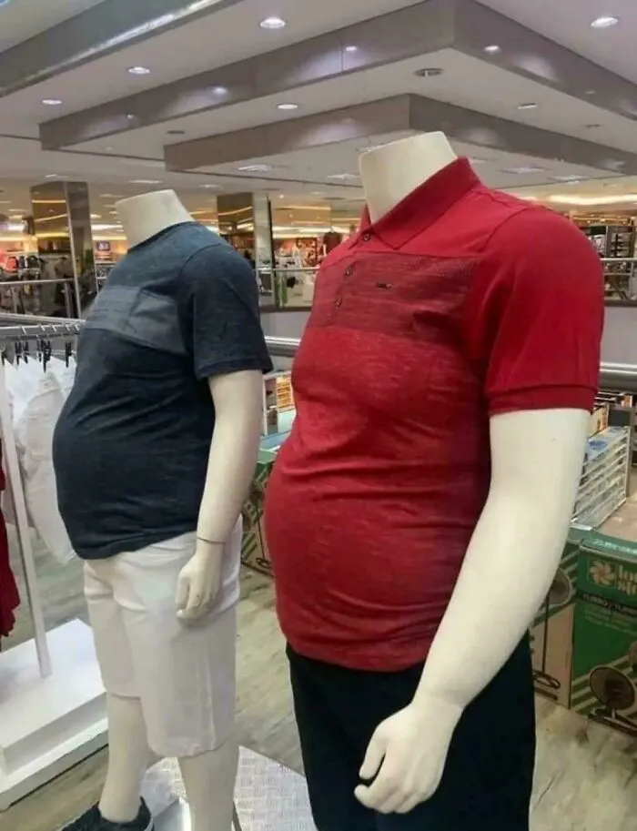 Mannequins with bloated stomachs in clothing store display