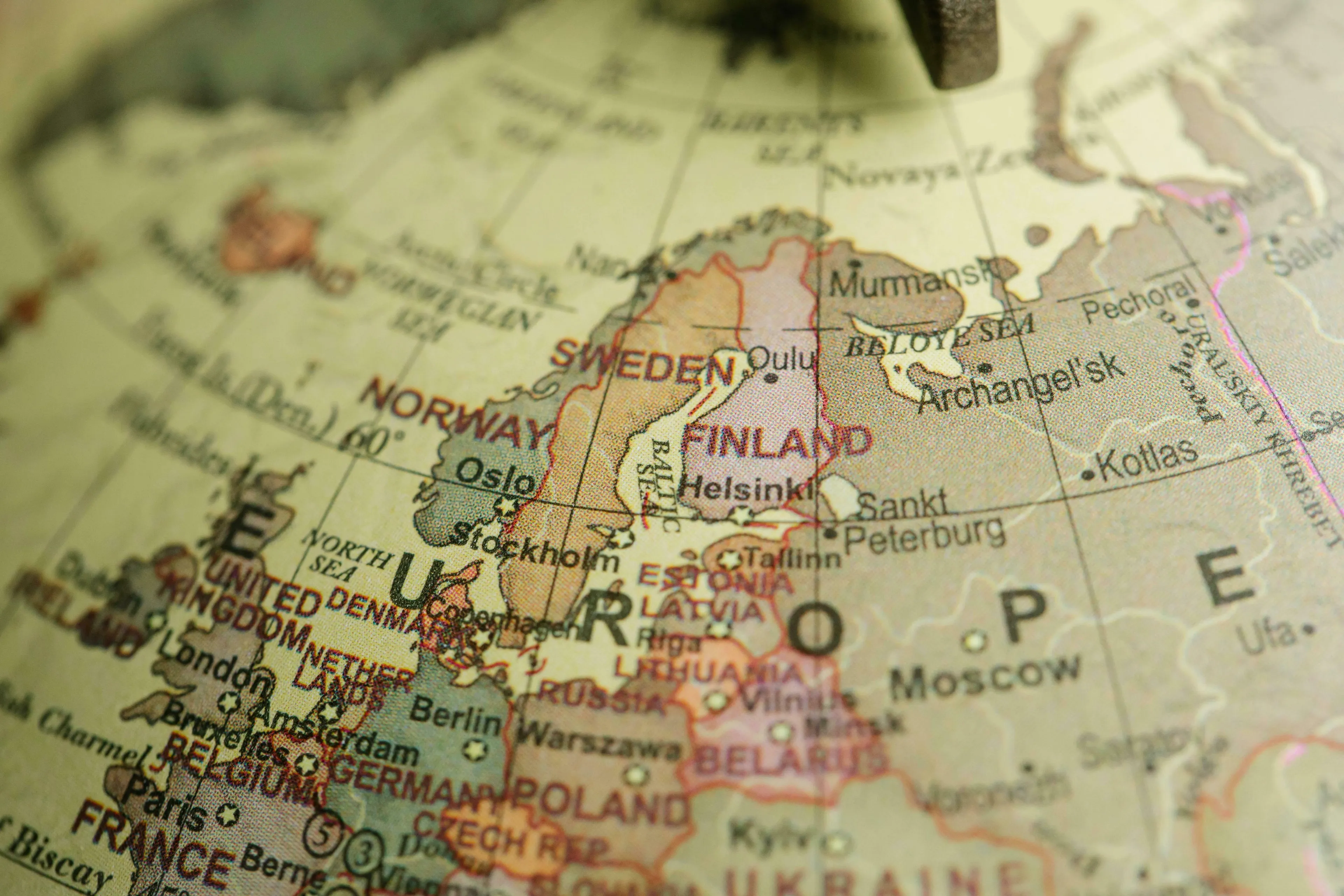 A close-up of a globe showing Europe, highlighting Finland, Sweden, and Norway for a General Knowledge Quiz on Scandinavia.