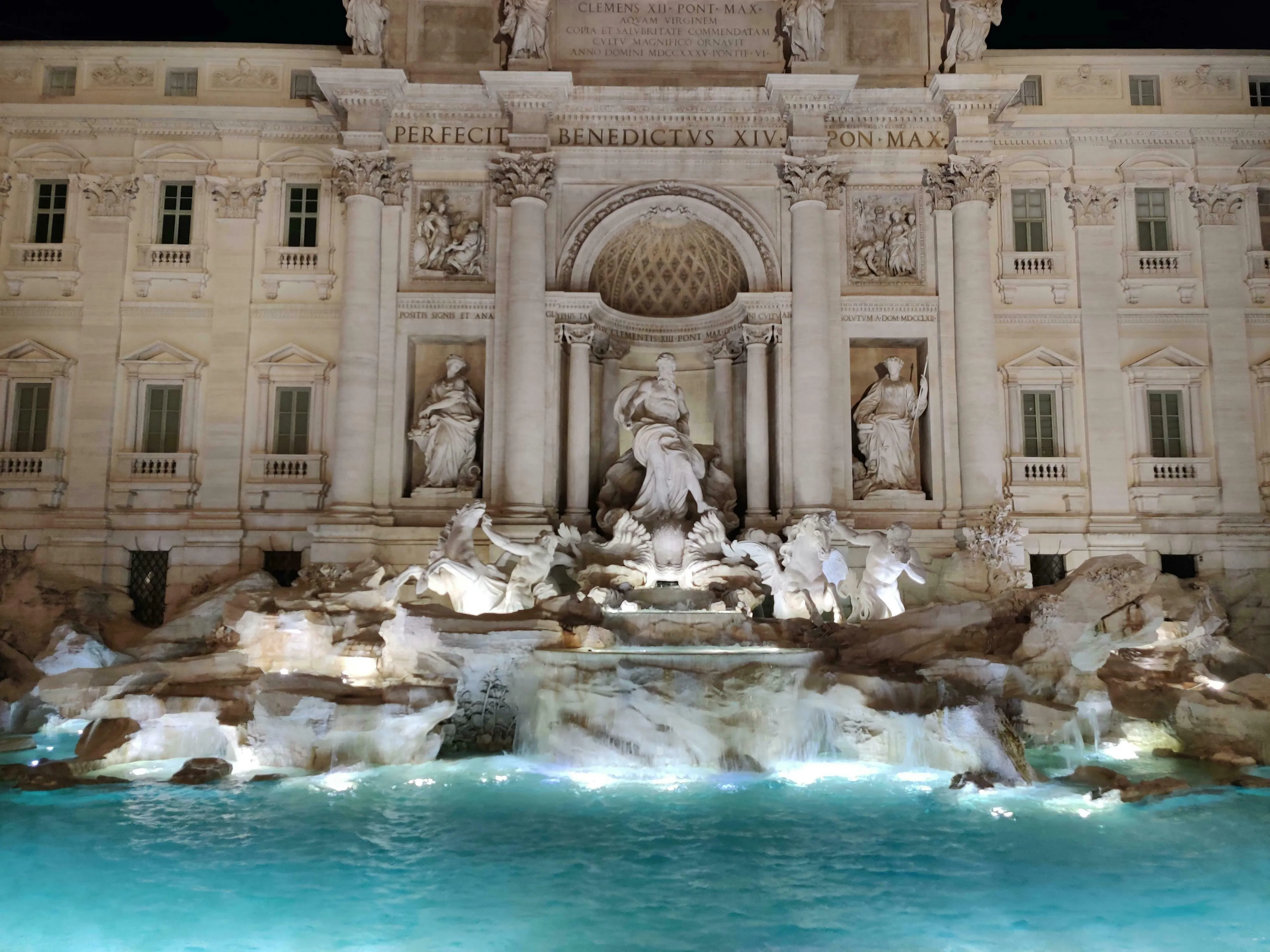 The Trevi Fountain, illuminated at night, featuring ornate sculptures and flowing water. A General Knowledge Quiz: Europe Questions.