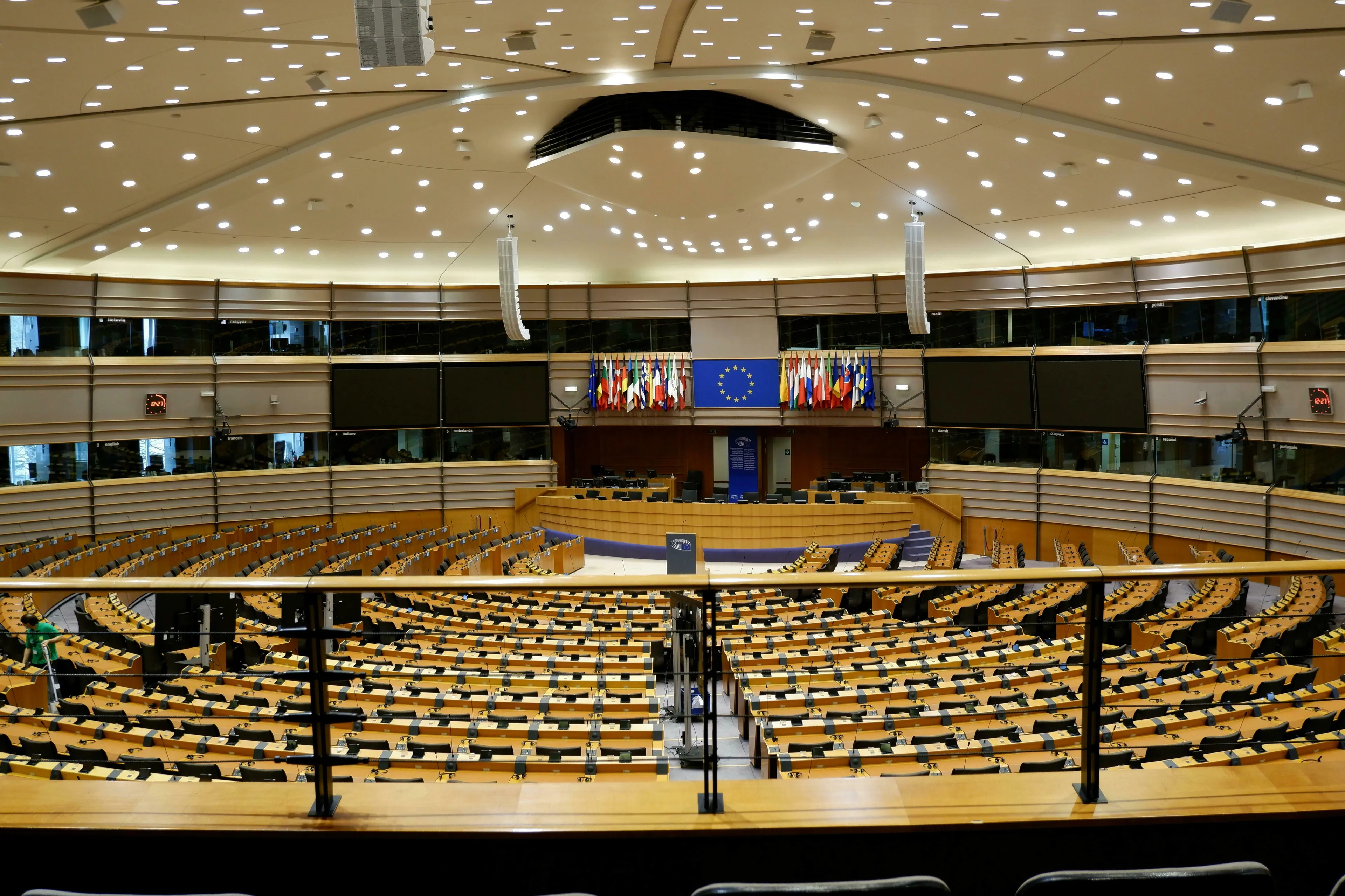 General Knowledge Quiz: The European Parliament plenary chamber in Brussels, flags of the European Union countries displayed.