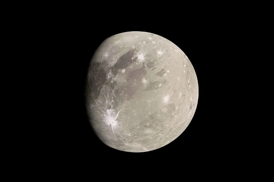 A detailed image of Ganymede, Jupiter's largest moon, showing its icy, cratered surface and potential subsurface ocean.