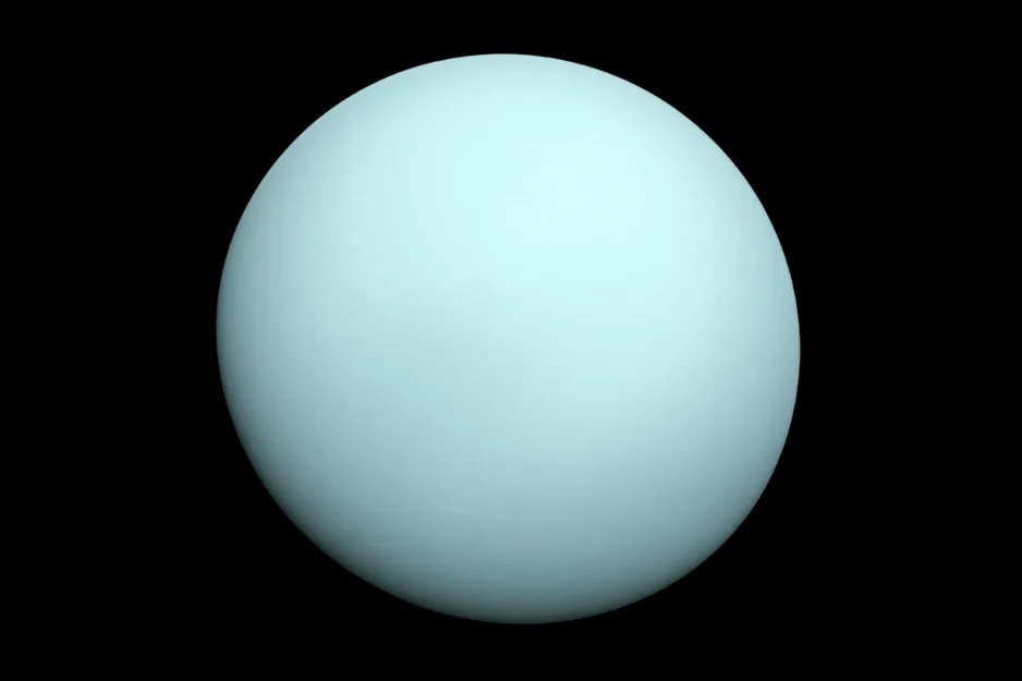 A smooth, light blue sphere of the planet Uranus against a dark black background.