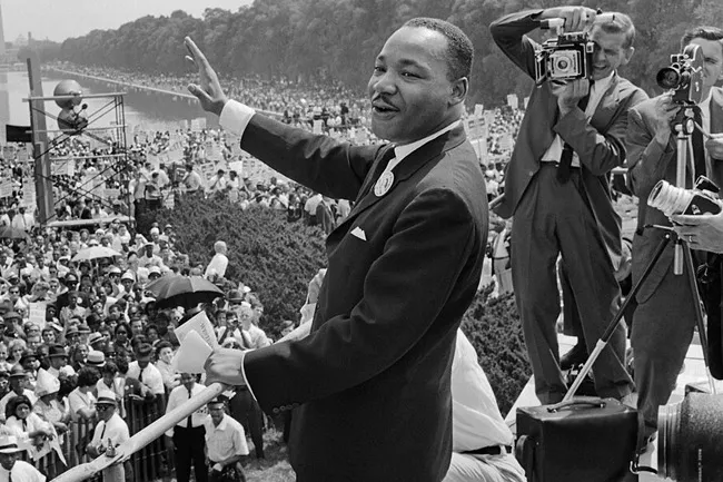 Martin Luther King Jr. delivering the "I Have a Dream" Speech to a massive crowd at the March on Washington.