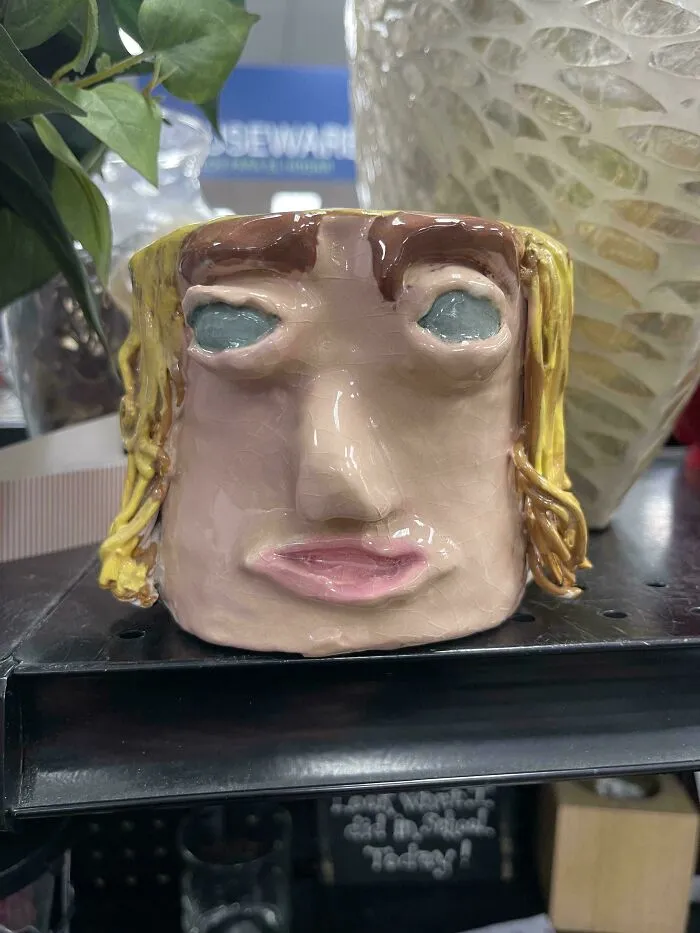 Quirky handmade ceramic face mug thrifted from goodwill shelf