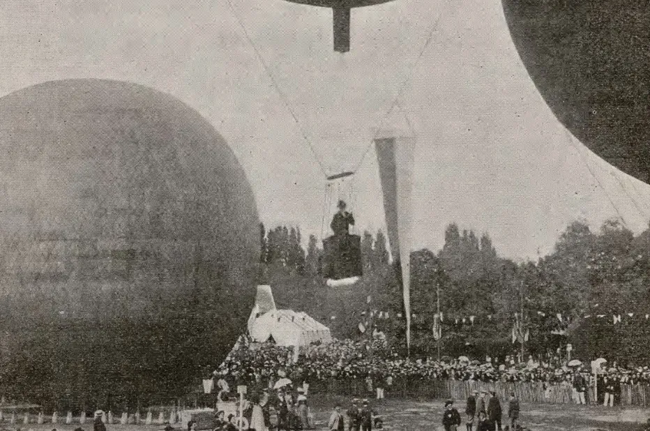 Industrial Revolution hot air balloons with a person in a basket descending over a large crowd and trees.