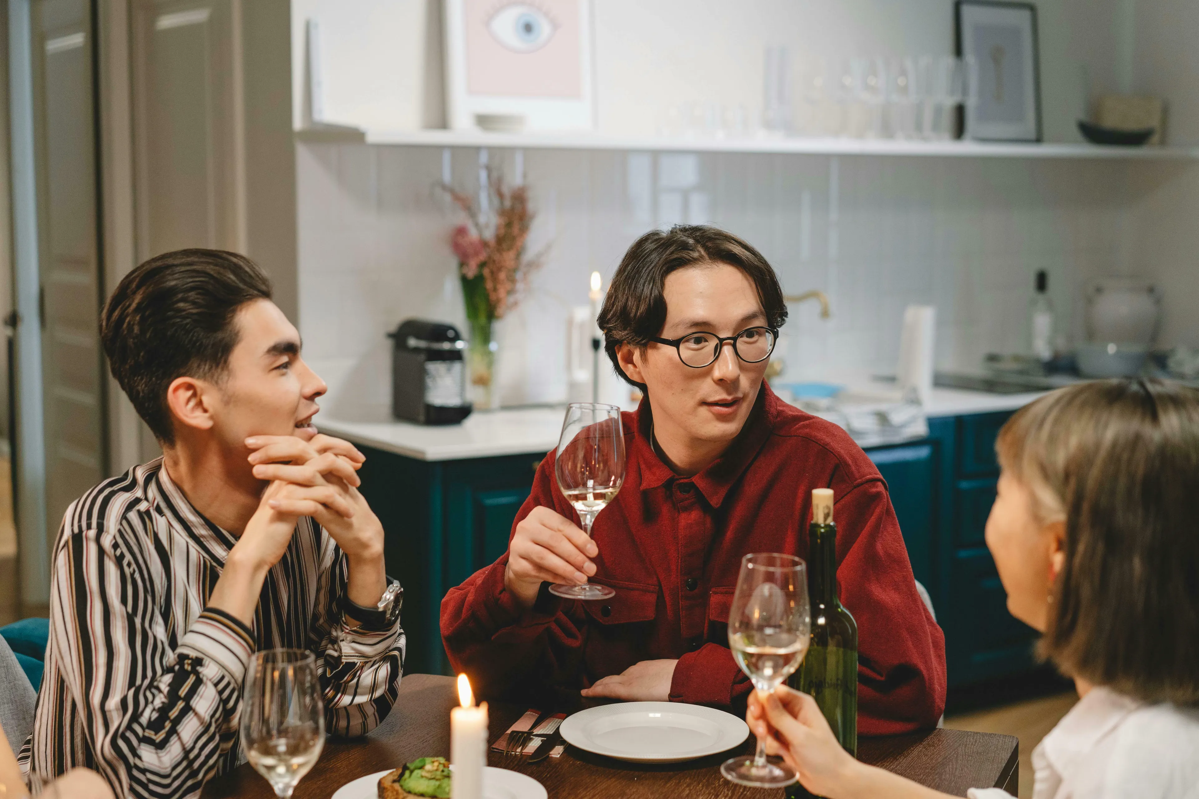 Friends at a dinner party, deep in conversation about which season reflects their true nature.