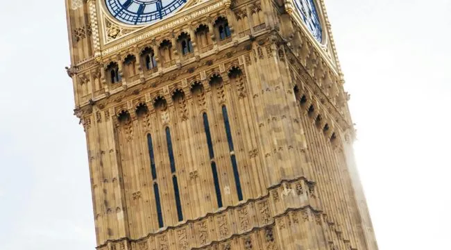 A zoomed-in photo of Big Ben, a famous landmark, showing its ornate clock face with blue numerals and hands.